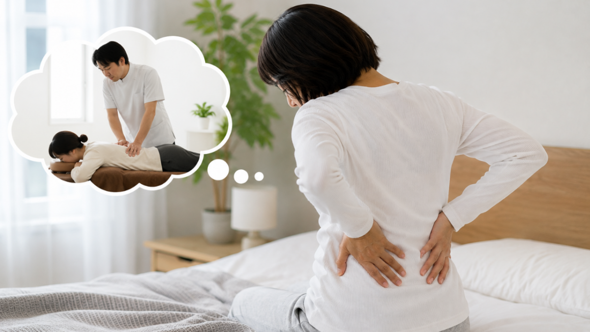 腰を押さえていたそうにしている女性